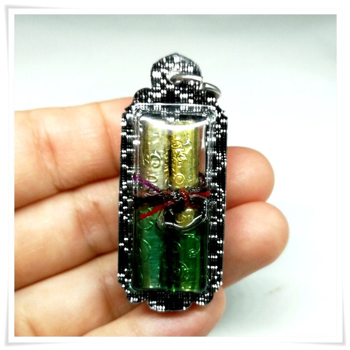 Magic Pendant (Takrut Koo Na Oak Dtak) The double Takrut within Charming Oil